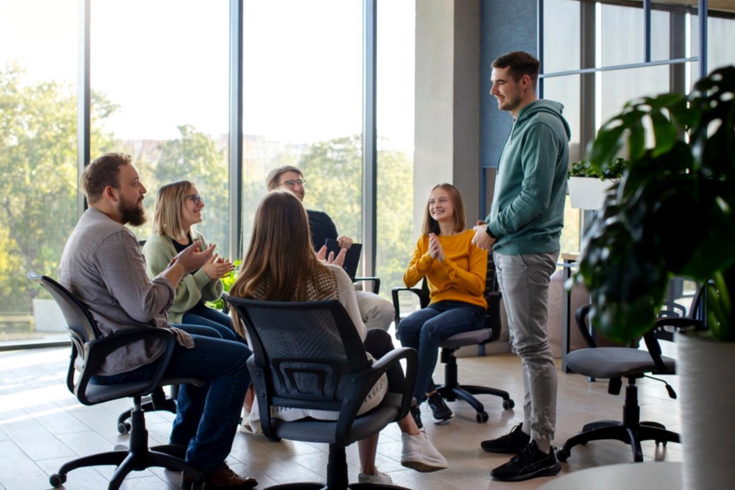 Person reviewing budget planning documents with calculator and notebook
