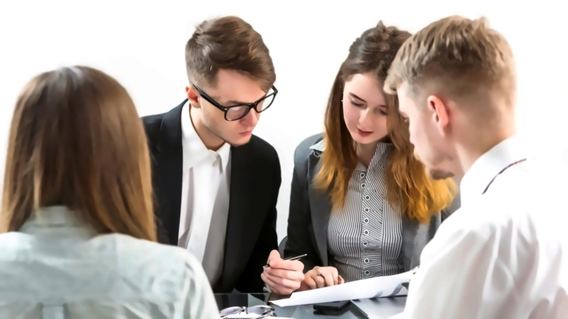 Students reviewing budget worksheets during practical session